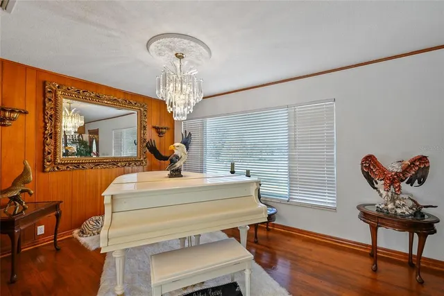 a room with pool table and windows