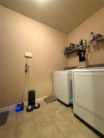 a spacious bathroom with a toilet sink and mirror