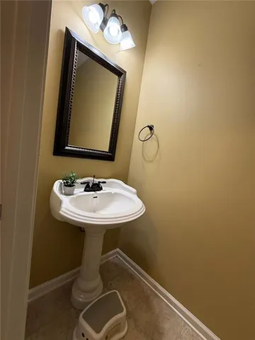 a bathroom with a toilet a sink and a shower