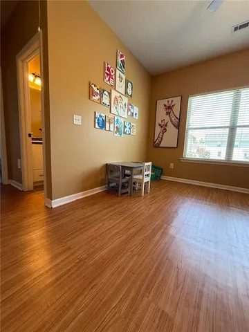 a view of a room with toys and a chandelier