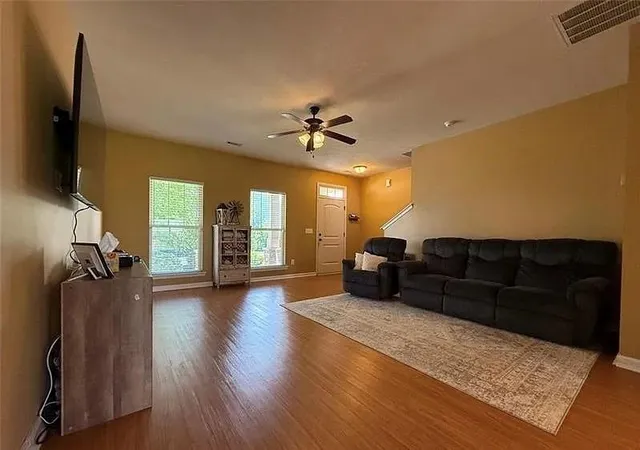 a kitchen with granite countertop wooden cabinets and a sink