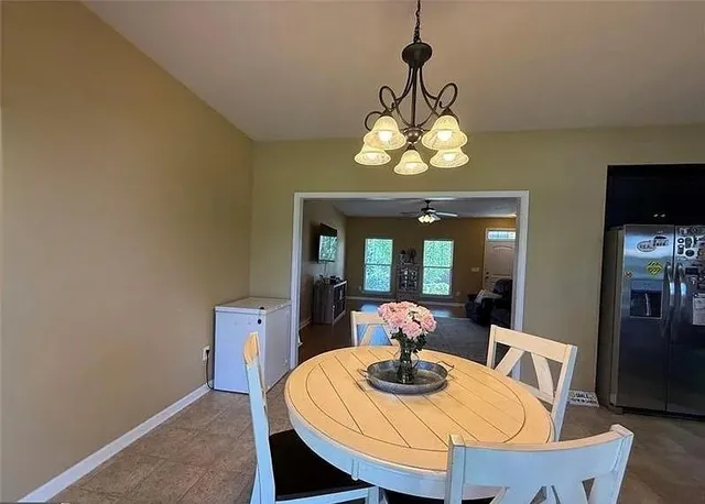 a kitchen with a refrigerator and a sink