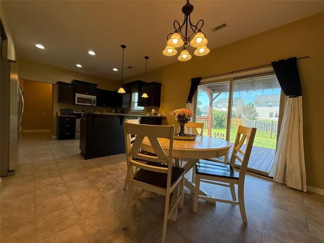 a view of room with walk in closet and bathroom
