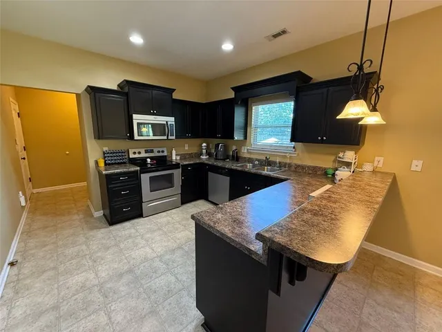 a bathroom with a sink a mirror and a toilet