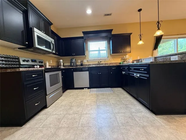 a white toilet sitting next to a white wall