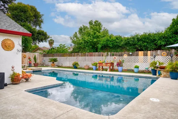 a view of swimming pool with seating space