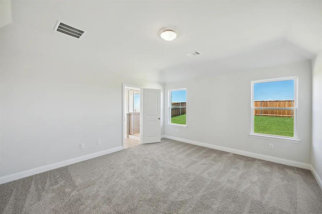 2906 Halcyon Street Princeton, TX 75407 - Photo 3 of 11 an empty room with windows