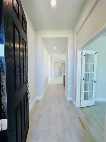wooden floor with a bathroom