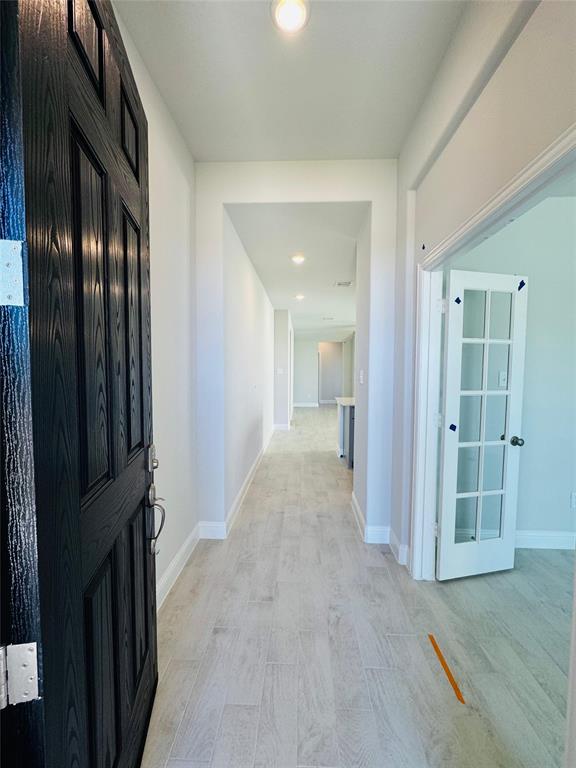 2906 Halcyon Street Princeton, TX 75407 - Photo 9 of 11 wooden floor with a bathroom
