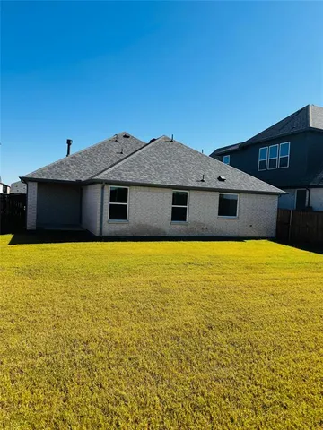 a front view of a house with a swimming pool