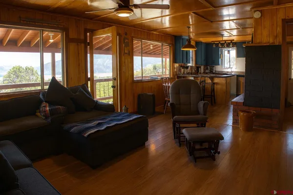 a living room with furniture and a large window