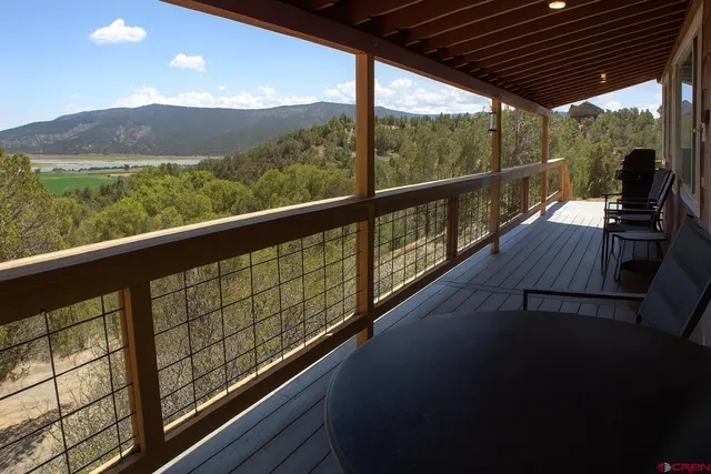 a view of balcony with furniture