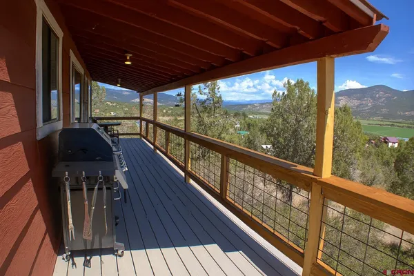 a view of balcony with furniture