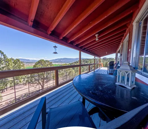 a view of a balcony with chairs