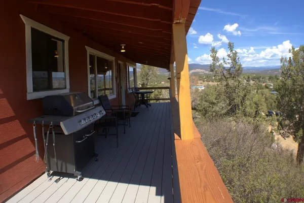 a view of a balcony with chairs