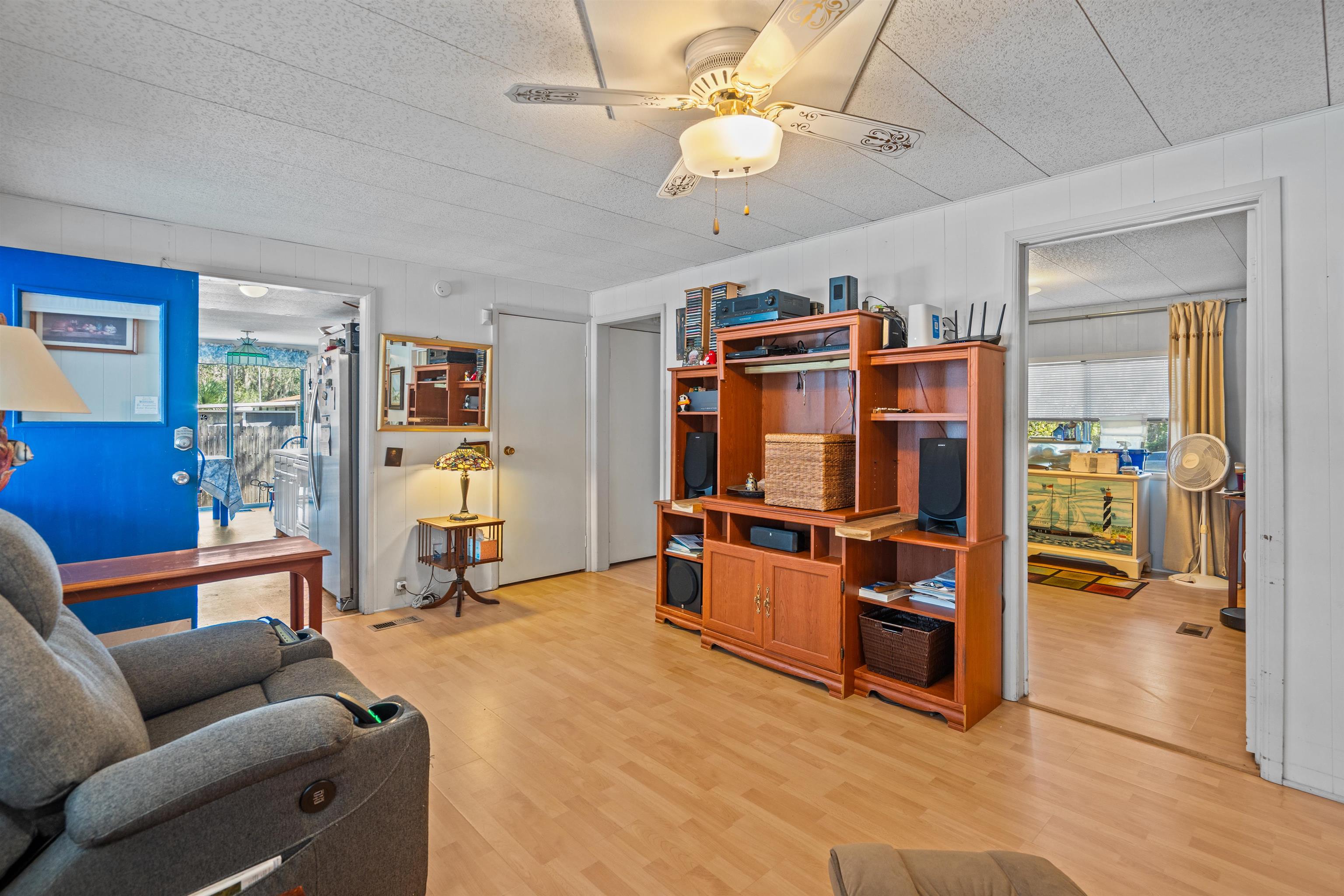 3979 Oak Terrace Road St. Augustine, FL 32086 - Photo 14 of 36 a view of a livingroom with furniture and a ceiling fan