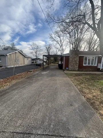 front view of a house with a dry yard