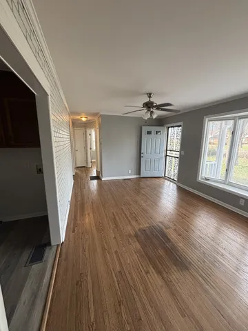 a view of gallery with wooden floor
