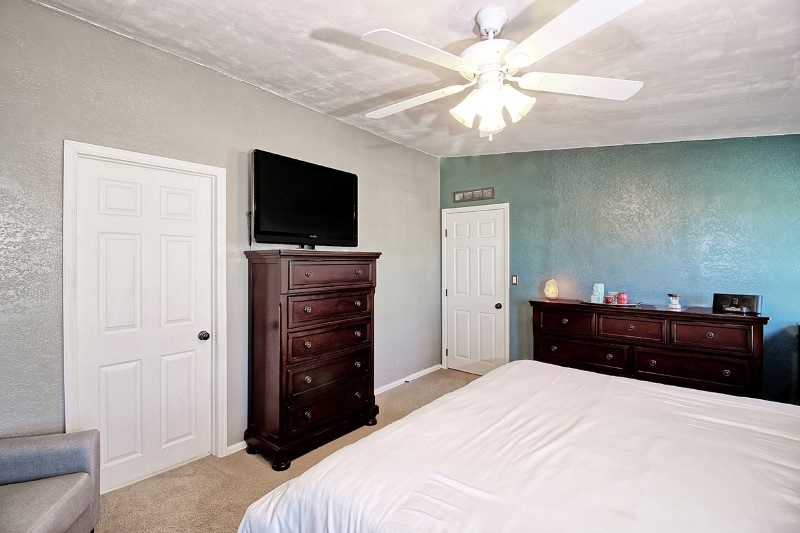796 Siminoe Road Whitewater, CO 81527 - Photo 13 of 37 a bed room with a bed and a television