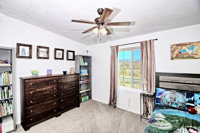 796 Siminoe Road Whitewater, CO 81527 - Photo 15 of 37 a room with a bed and a window