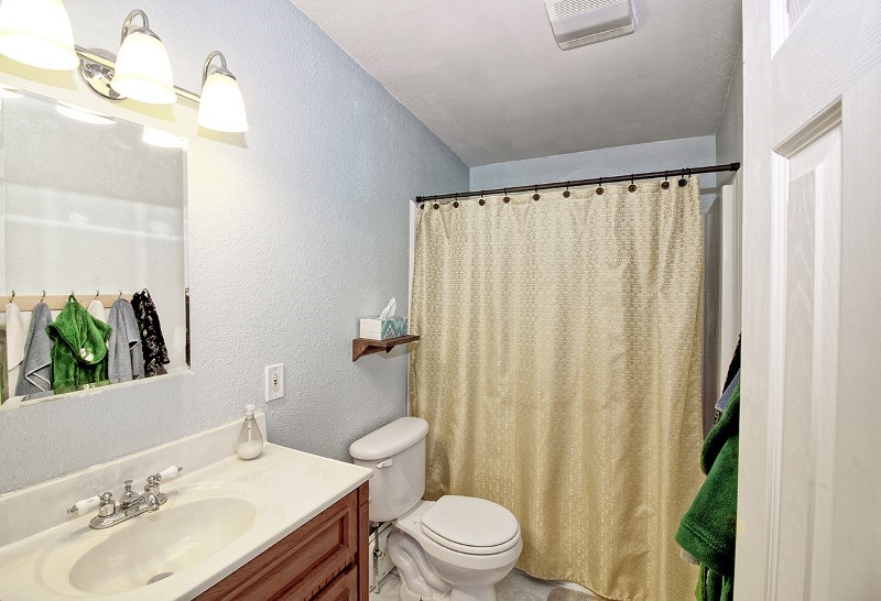 796 Siminoe Road Whitewater, CO 81527 - Photo 22 of 37 a bathroom with a sink a toilet and shower curtain