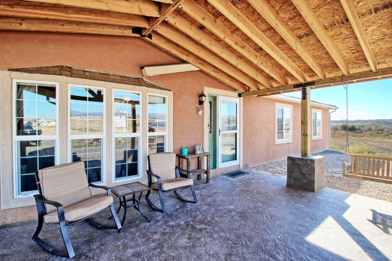 796 Siminoe Road Whitewater, CO 81527 - Photo 28 of 37 a living room with furniture and a floor to ceiling window