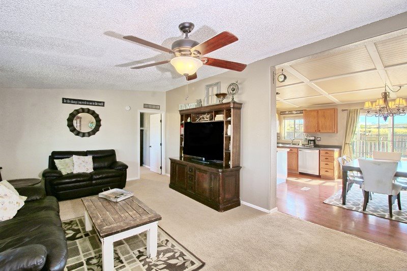 796 Siminoe Road Whitewater, CO 81527 - Photo 3 of 37 a living room with furniture and a flat screen tv