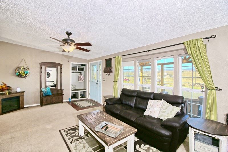 796 Siminoe Road Whitewater, CO 81527 - Photo 5 of 37 a living room with furniture and a large window