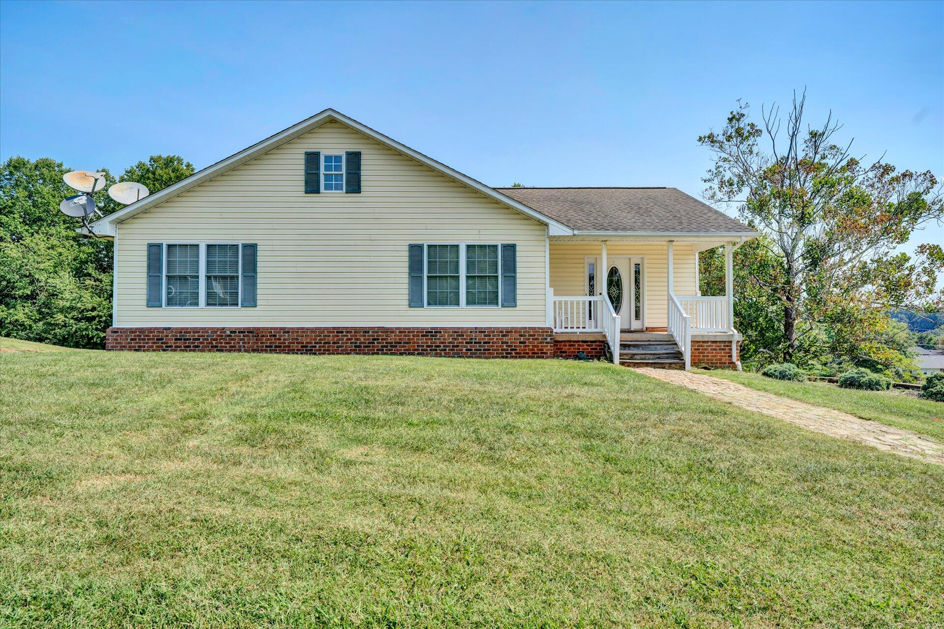 130 Highfield Road Rocky Mount, VA 24151 - Photo 2 of 23 a front view of a house with a yard and porch