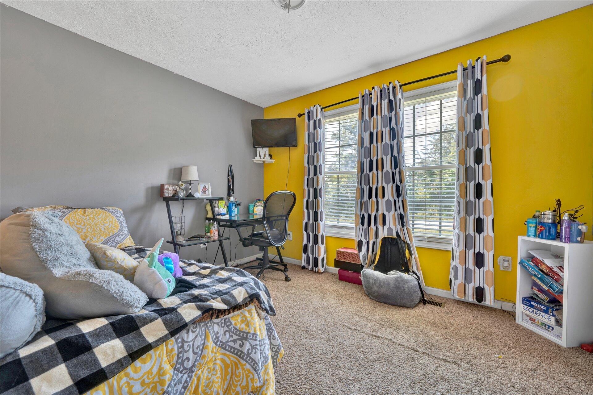 130 Highfield Road Rocky Mount, VA 24151 - Photo 11 of 23 a living room with furniture and a floor to ceiling window