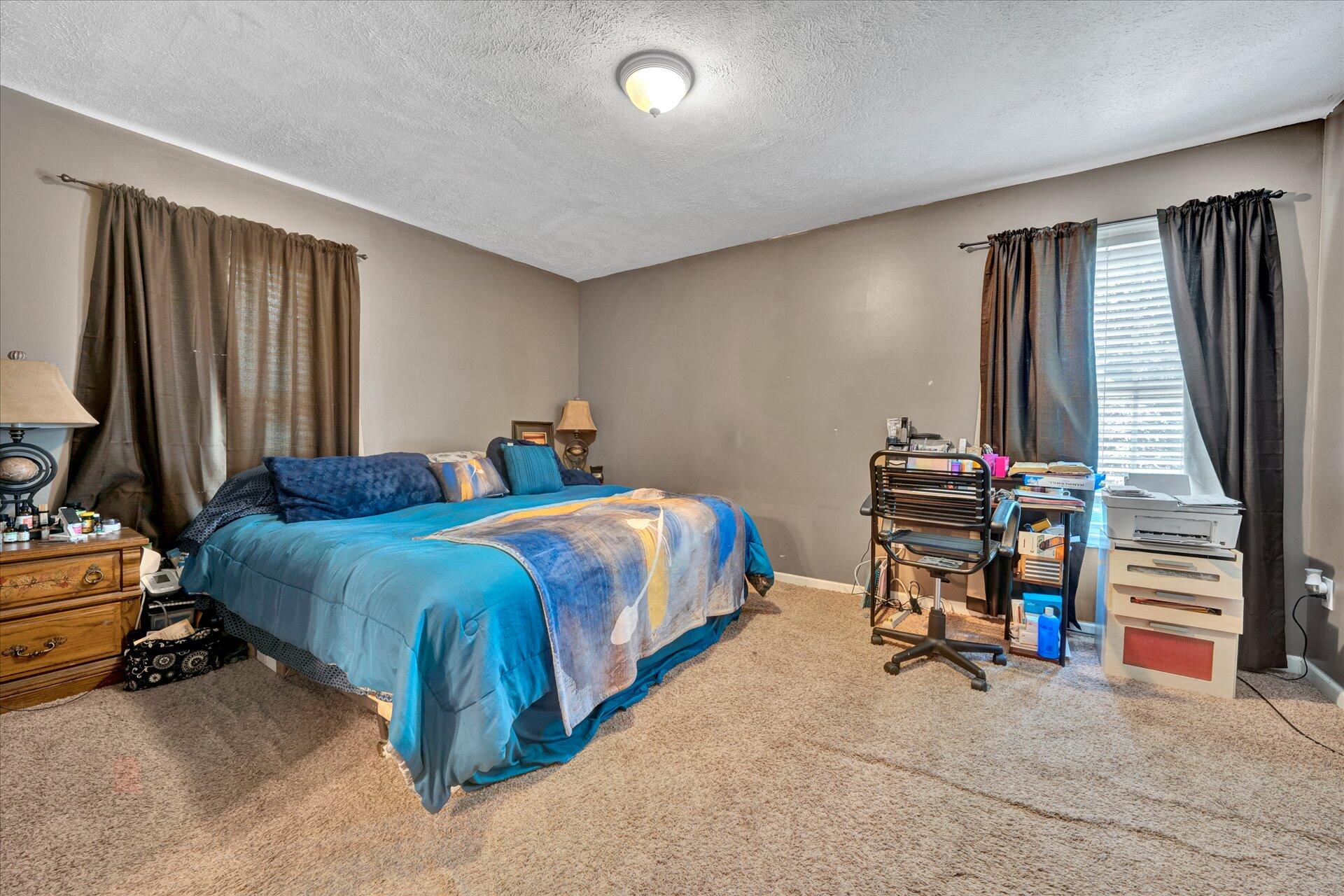 130 Highfield Road Rocky Mount, VA 24151 - Photo 14 of 23 a bed room with a bed and a television