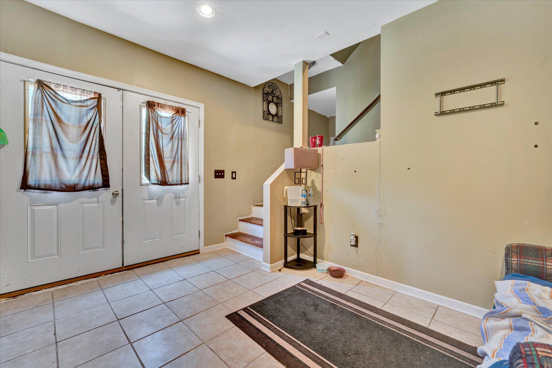 130 Highfield Road Rocky Mount, VA 24151 - Photo 17 of 23 a view of a livingroom with stairs and a couch