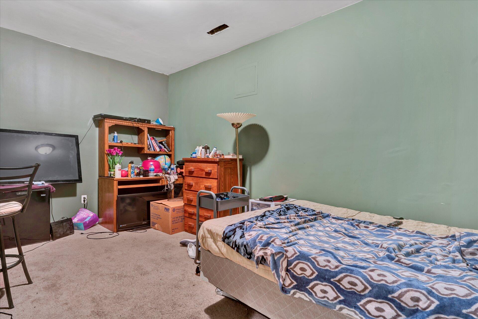 130 Highfield Road Rocky Mount, VA 24151 - Photo 19 of 23 a bedroom with a bed and wooden floor