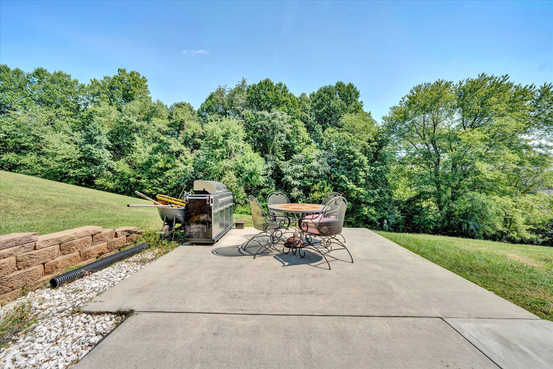 130 Highfield Road Rocky Mount, VA 24151 - Photo 21 of 23 a view of a patio with a table and chairs