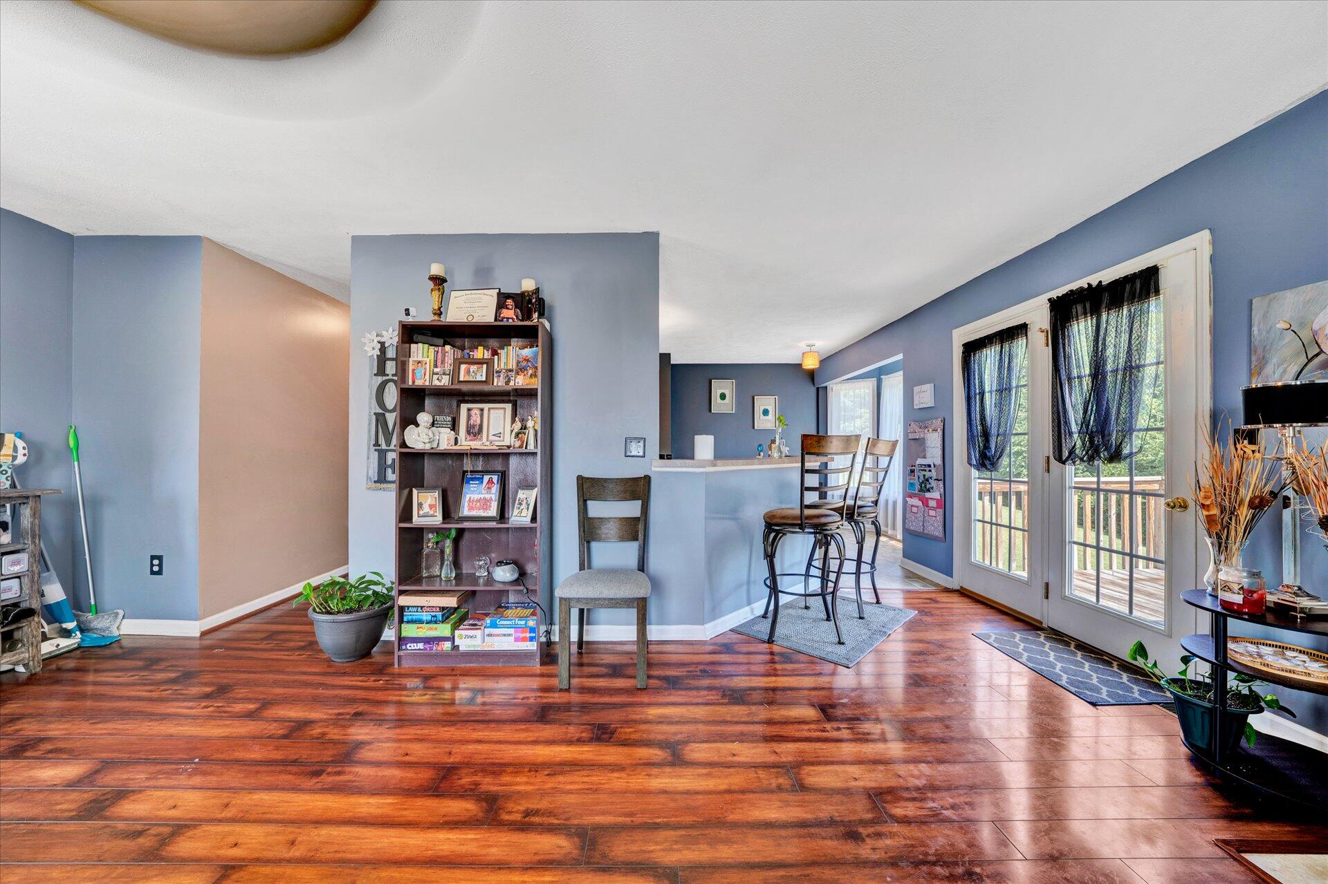 130 Highfield Road Rocky Mount, VA 24151 - Photo 5 of 23 a living room with furniture and a book shelf