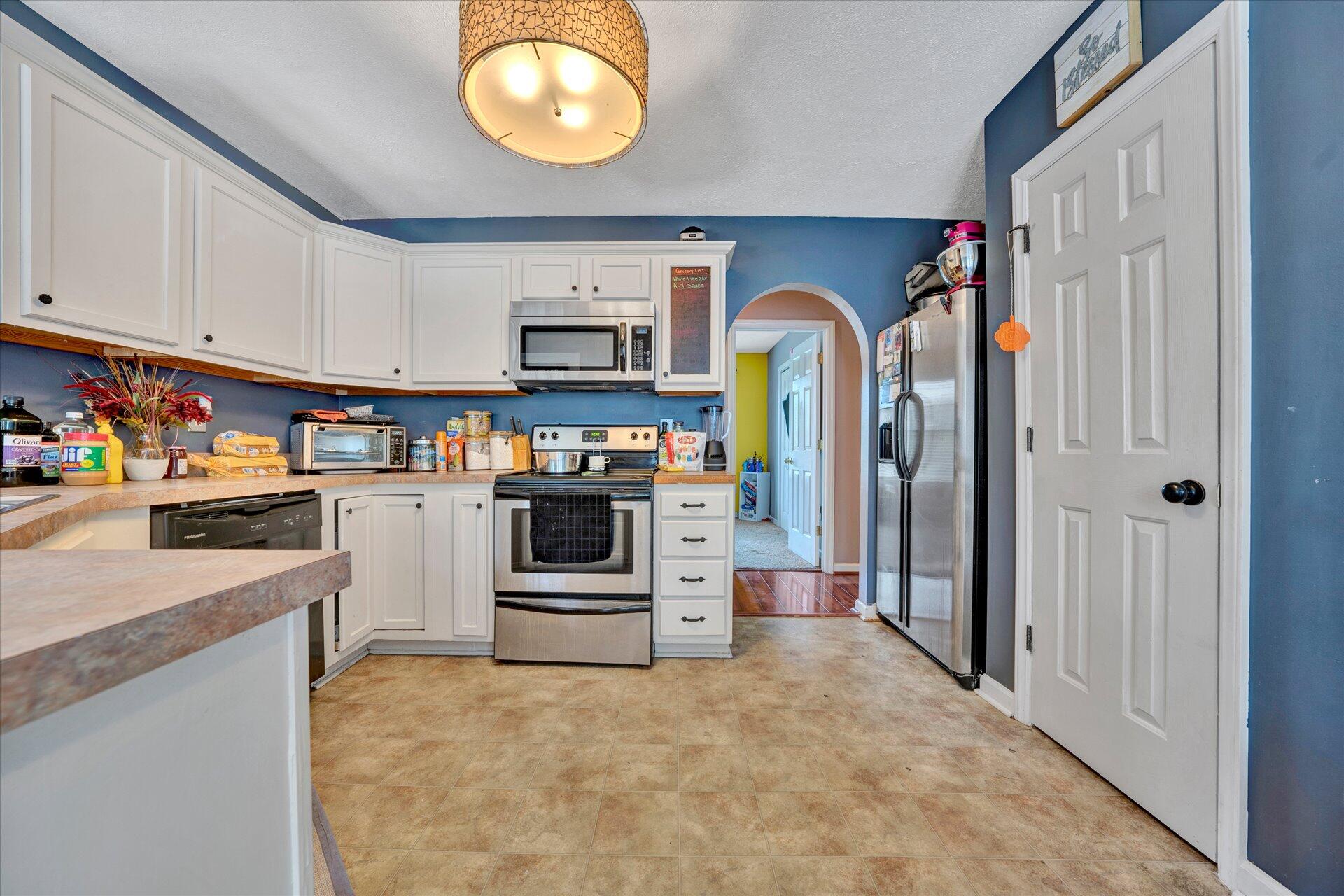 130 Highfield Road Rocky Mount, VA 24151 - Photo 8 of 23 a kitchen with stainless steel appliances granite countertop a refrigerator and a stove top oven