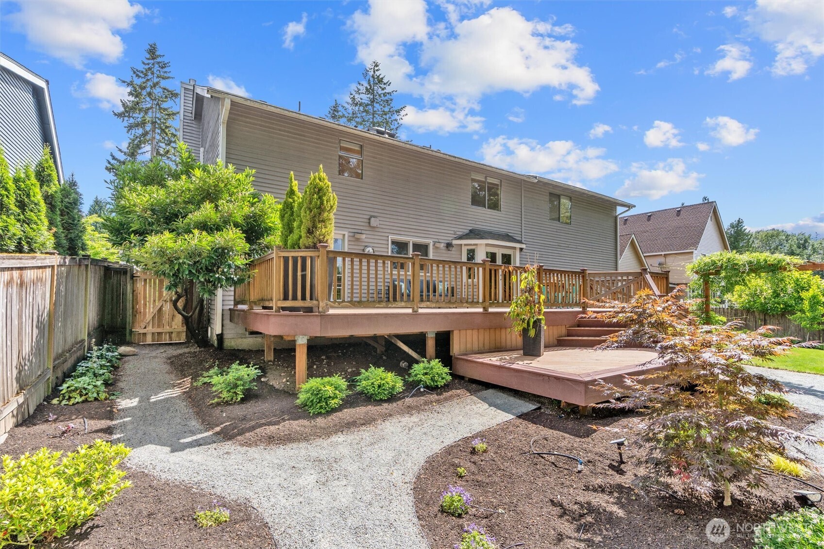 2101 233rd Street Southeast Bothell, WA 98021 - Photo 34 of 40 a front view of a house with garden