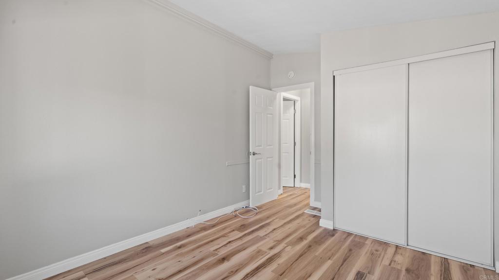13490 Highway 8 Business, Unit 8 Lakeside, CA 92040 - Photo 11 of 29 a view of room with wooden floor
