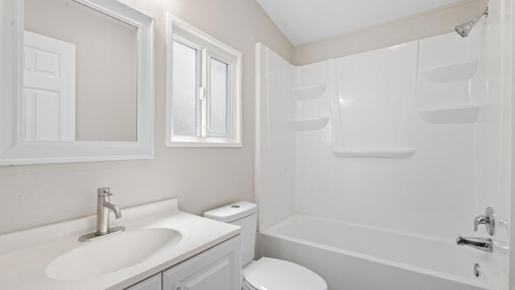 13490 Highway 8 Business, Unit 8 Lakeside, CA 92040 - Photo 19 of 29 a bathroom with a sink toilet and bathtub