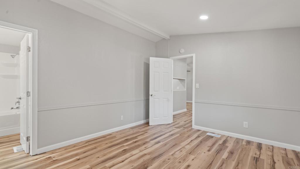 13490 Highway 8 Business, Unit 8 Lakeside, CA 92040 - Photo 20 of 29 a view of empty room with wooden floor