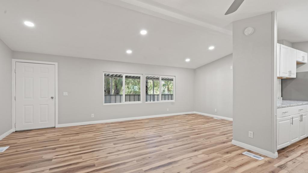 13490 Highway 8 Business, Unit 8 Lakeside, CA 92040 - Photo 4 of 29 a view of empty room with wooden floor and fan