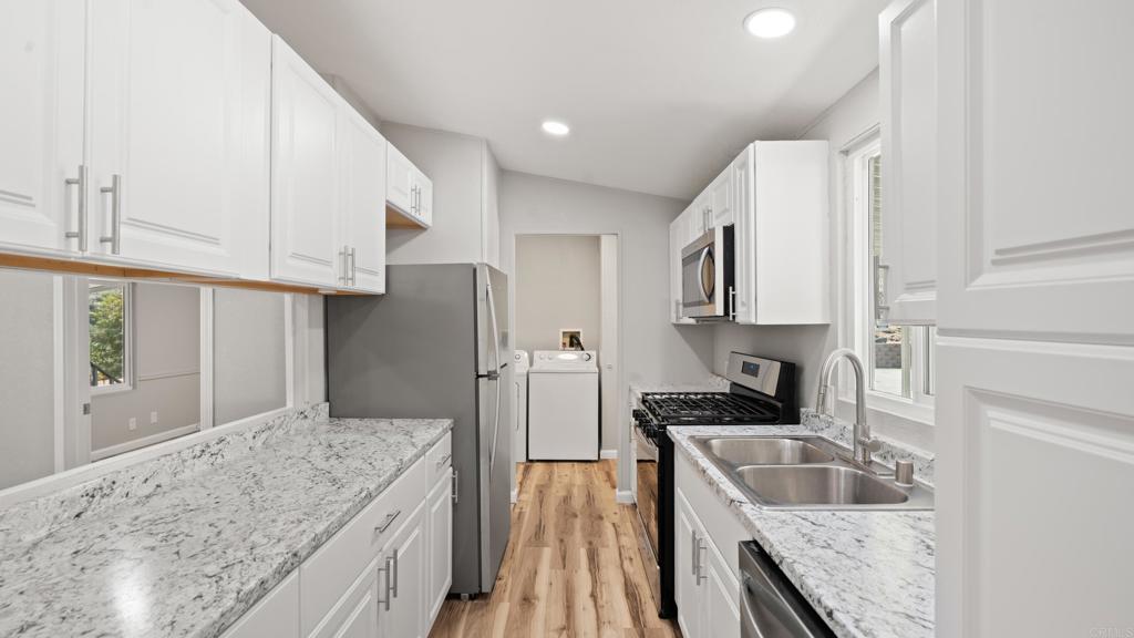 13490 Highway 8 Business, Unit 8 Lakeside, CA 92040 - Photo 6 of 29 a kitchen with a sink stove and refrigerator