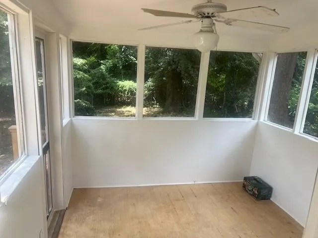 a view of a house with a yard and deck