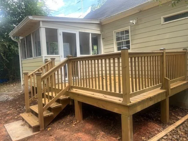 a view of a wooden house with a yard