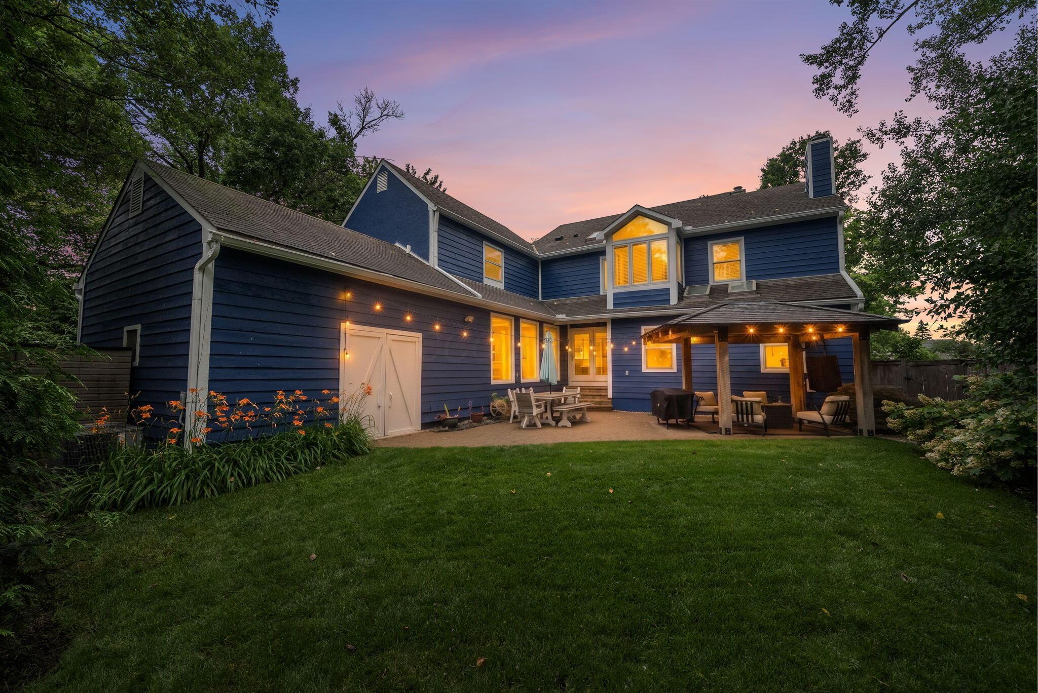 1851 Berkshire Road Columbus, OH 43221 - Photo 81 of 125 Backyard nighttime views, yard, garage access, back patio perfect for entertaining.