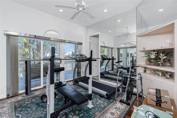 a living room with furniture a rug and white walls