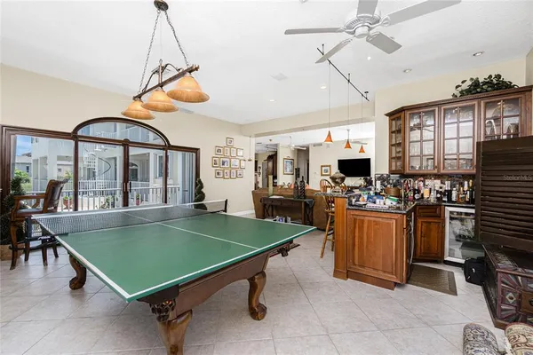 a bed room with a bed and a chandelier