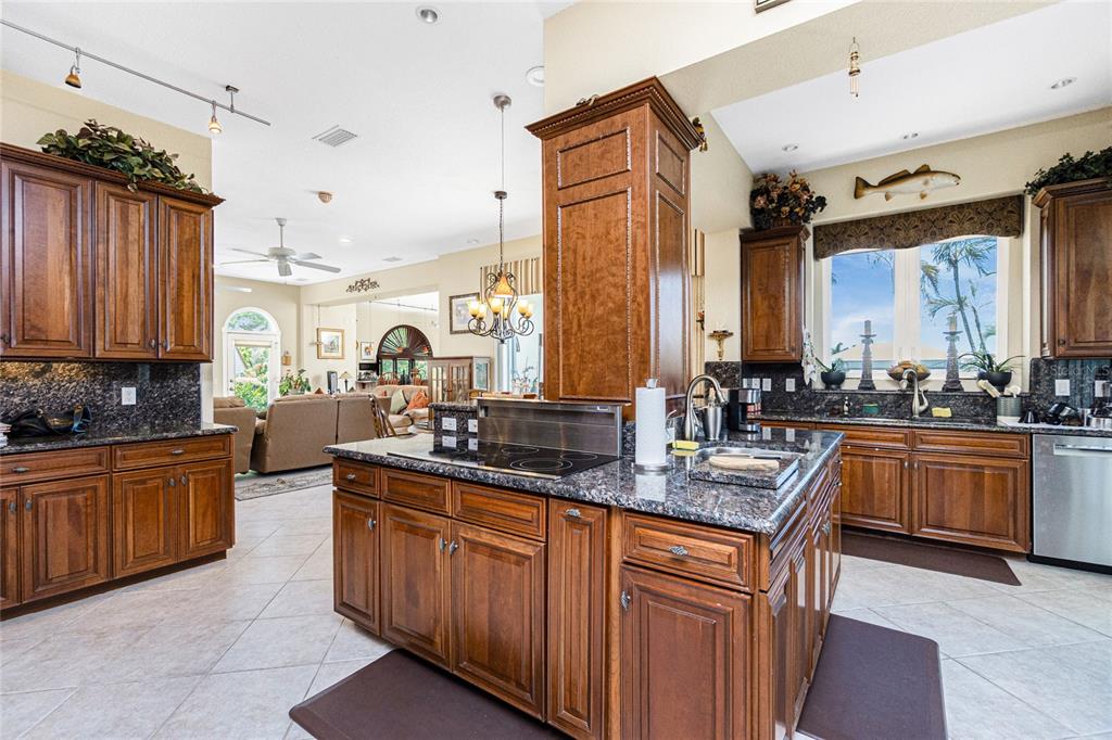 202 George Road Southeast Port Charlotte, FL 33952 - Photo 36 of 100 a kitchen with stainless steel appliances a sink stove and cabinets