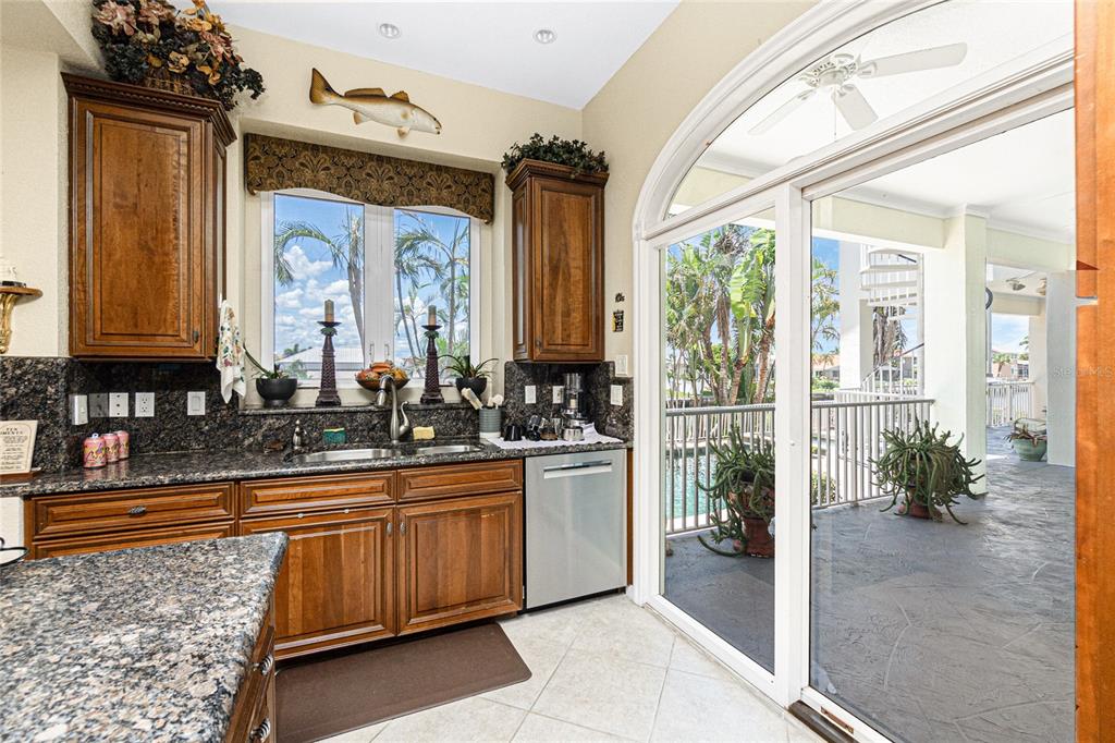 202 George Road Southeast Port Charlotte, FL 33952 - Photo 39 of 100 a bathroom with a granite countertop sink a large mirror and a shower