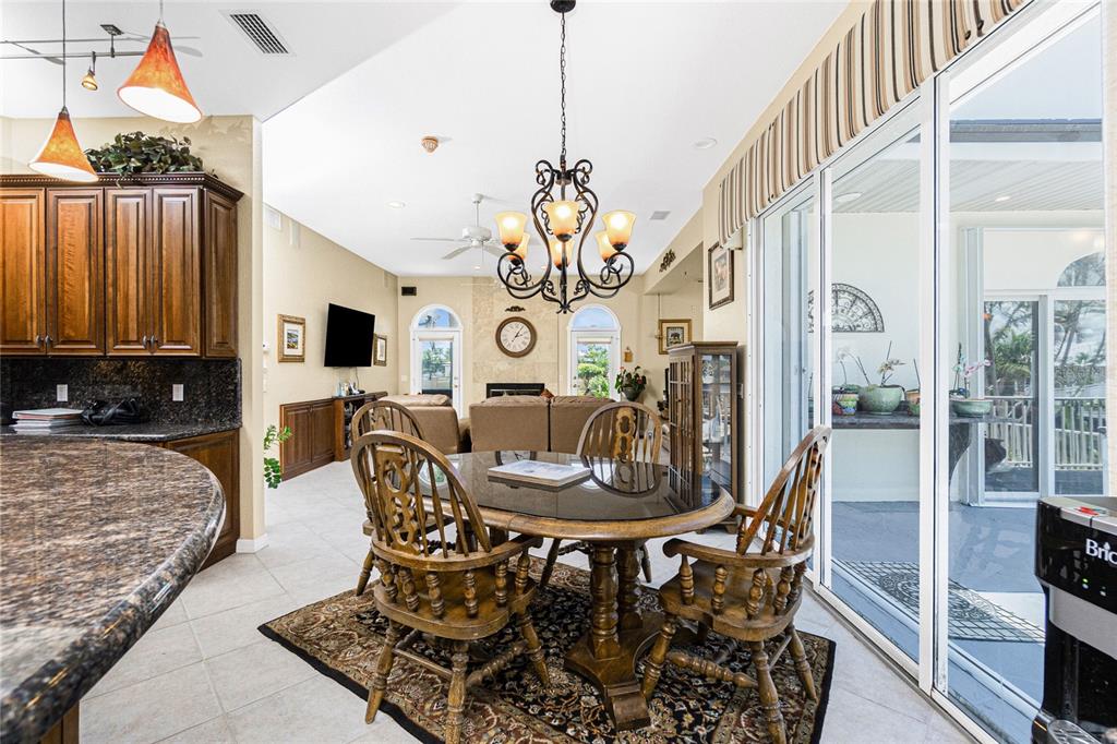 202 George Road Southeast Port Charlotte, FL 33952 - Photo 41 of 100 a view of a dining room with furniture and wooden floor